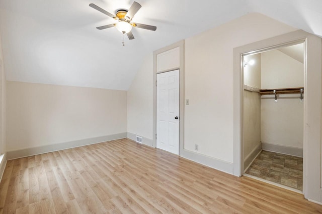 bonus room with ceiling fan, light hardwood / wood-style floors, and lofted ceiling