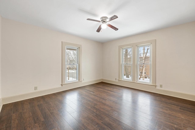 unfurnished room with ceiling fan and dark wood-type flooring