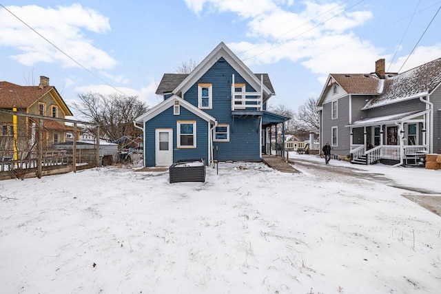 view of snow covered house