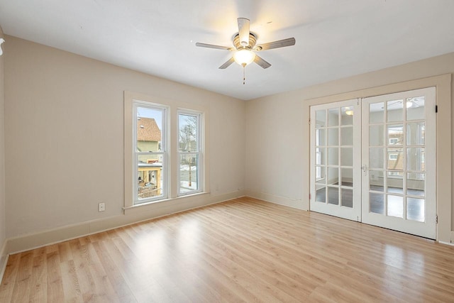 spare room featuring light hardwood / wood-style floors and ceiling fan