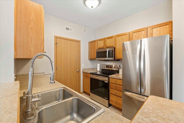 kitchen with sink and stainless steel appliances