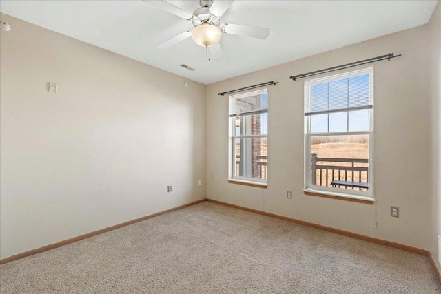 carpeted empty room with ceiling fan