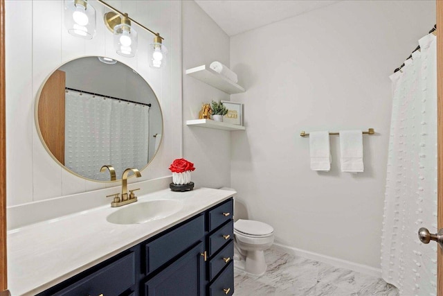 bathroom featuring toilet and vanity