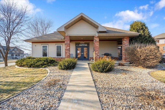 view of front of house with french doors and a porch