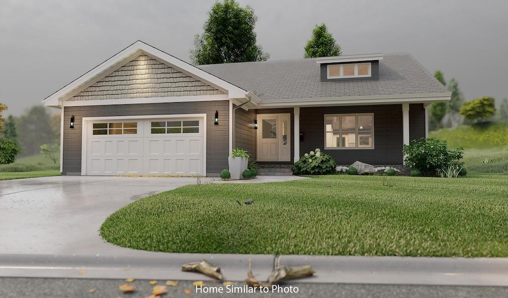 view of front facade featuring a garage and a front lawn