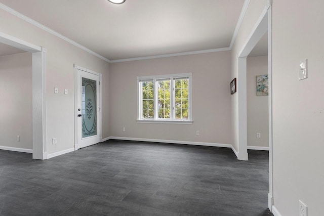 empty room featuring crown molding