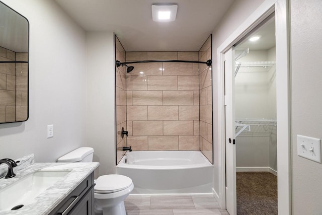 full bathroom featuring vanity, toilet, and tiled shower / bath combo