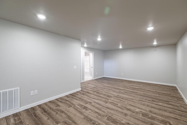 spare room featuring hardwood / wood-style floors