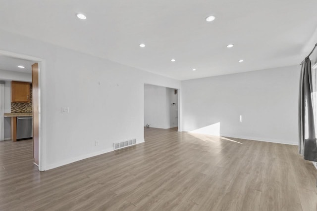 unfurnished living room with light hardwood / wood-style flooring