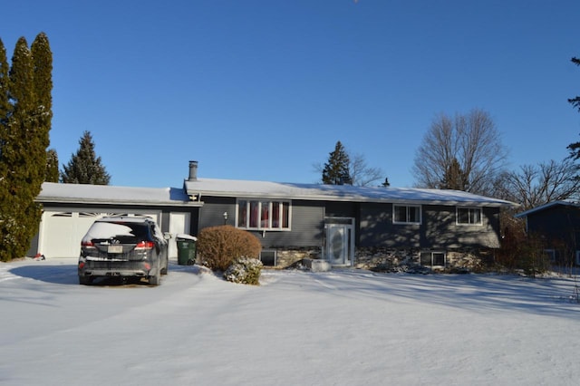 ranch-style home featuring a garage