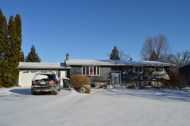 single story home featuring a garage