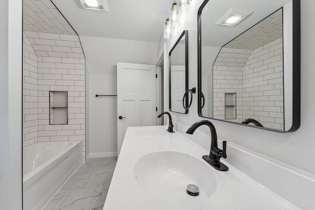 bathroom featuring sink and tiled shower / bath combo