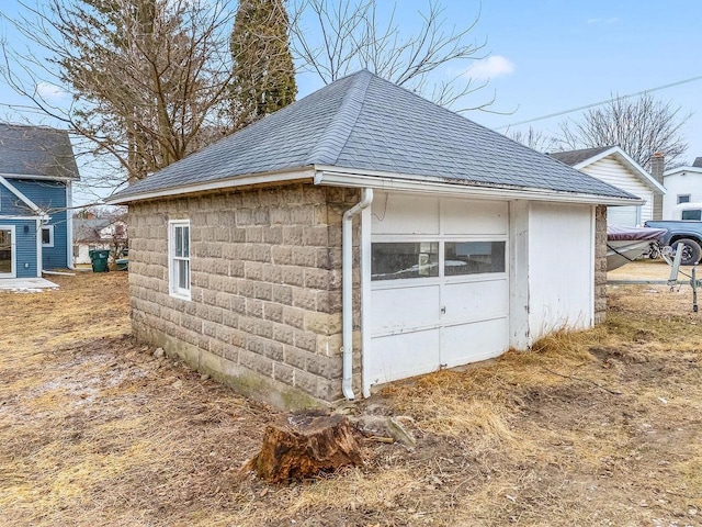 exterior space featuring an outbuilding and a garage