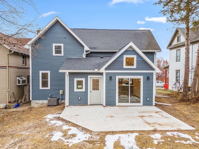 rear view of property featuring a patio area and cooling unit