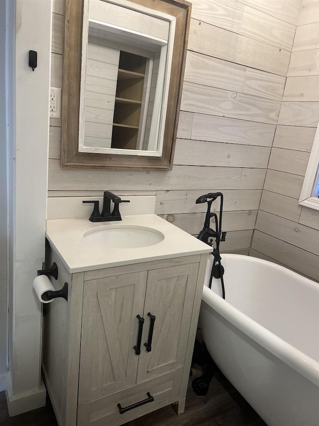 bathroom with vanity and a bathtub