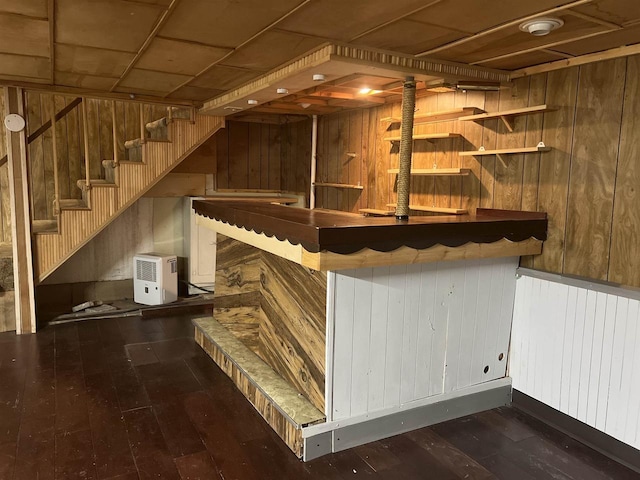 interior space featuring dark hardwood / wood-style floors, wood walls, and wood ceiling