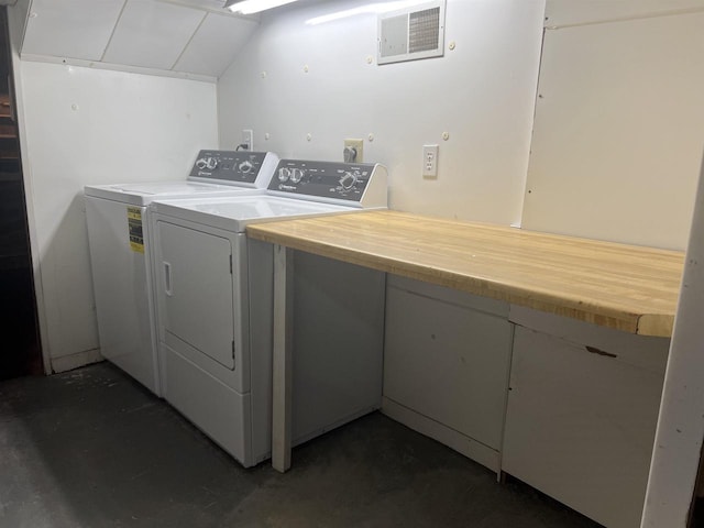 clothes washing area with washing machine and clothes dryer