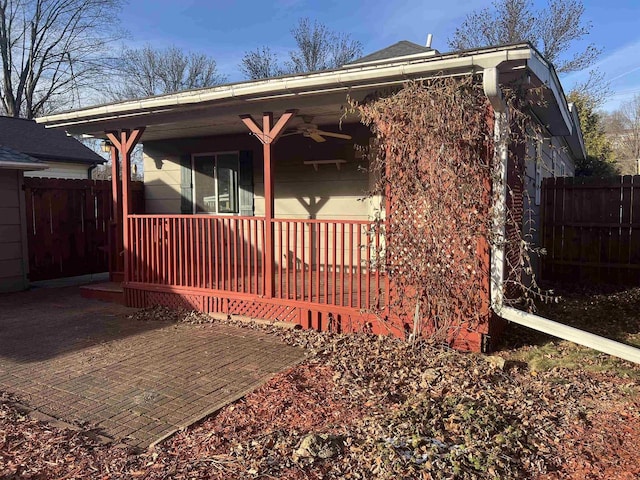 back of property featuring a porch