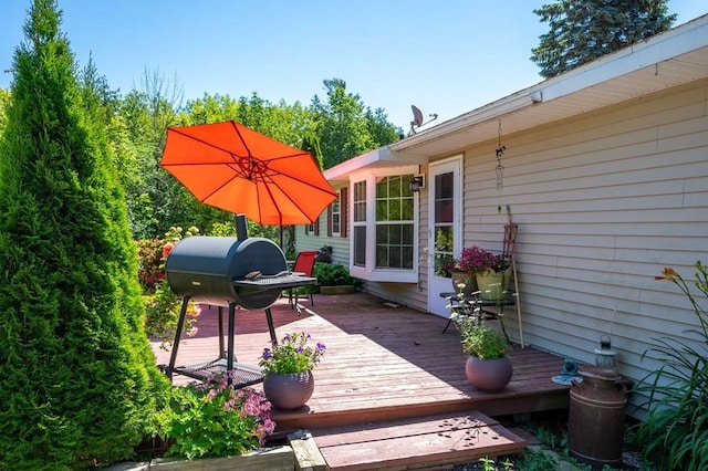 wooden terrace featuring grilling area