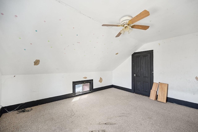 bonus room with ceiling fan, light colored carpet, and lofted ceiling