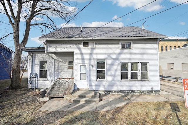 rear view of house with a patio