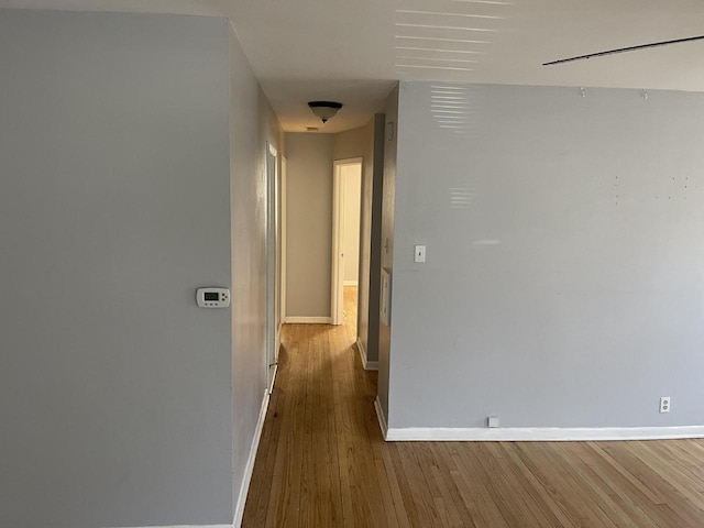 hallway featuring hardwood / wood-style flooring