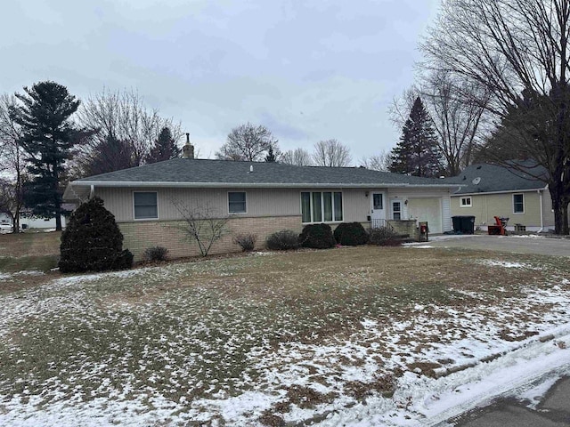 ranch-style house featuring a garage