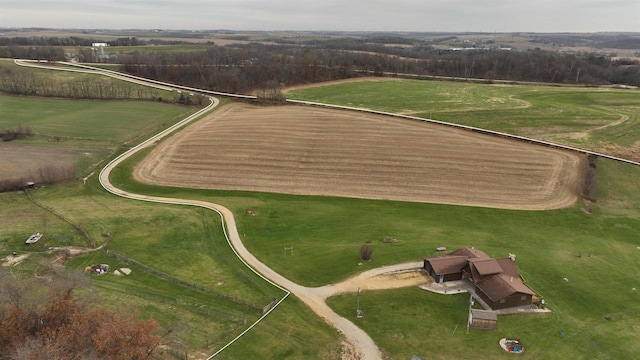 birds eye view of property with a rural view