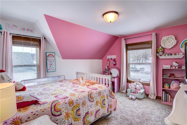 bedroom with multiple windows, carpet, and vaulted ceiling