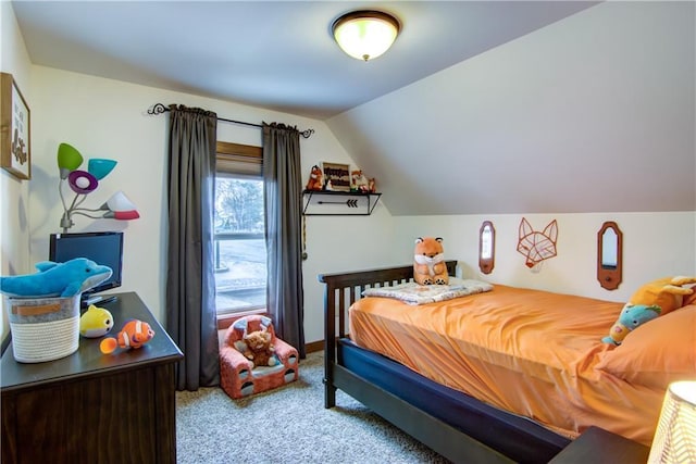 carpeted bedroom featuring vaulted ceiling