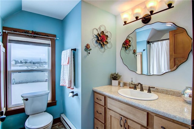 bathroom with a baseboard radiator, toilet, lofted ceiling, and vanity