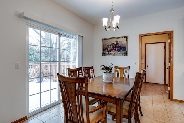 dining space featuring a chandelier and light tile patterned floors