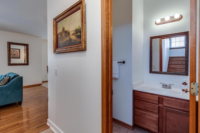 bathroom with vanity and wood-type flooring