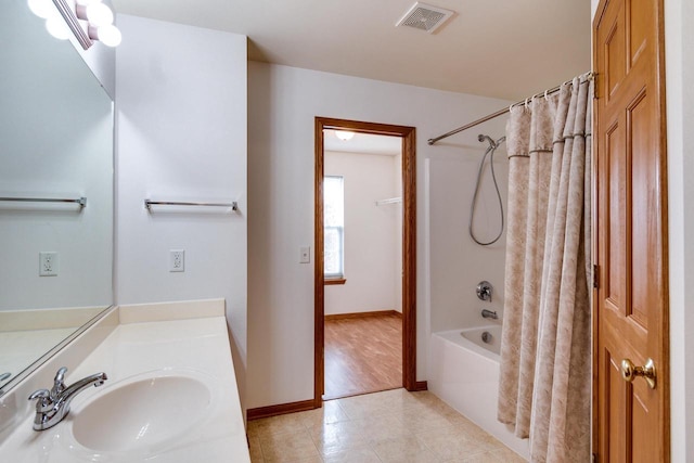 bathroom with vanity and shower / bath combo