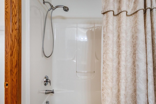 bathroom featuring shower / bath combination with curtain