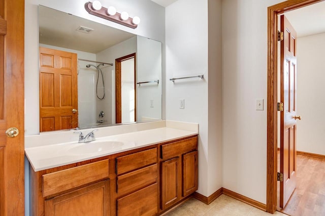 bathroom featuring shower / bathtub combination and vanity