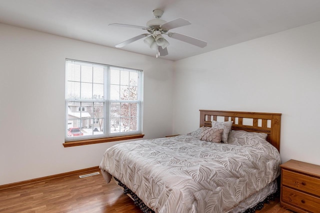 bedroom featuring wood-type flooring and ceiling fan