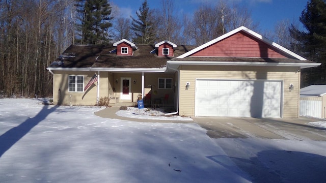 view of front of home featuring covered porch and a garage