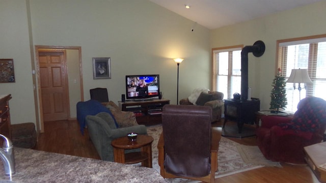 living room with hardwood / wood-style flooring and lofted ceiling