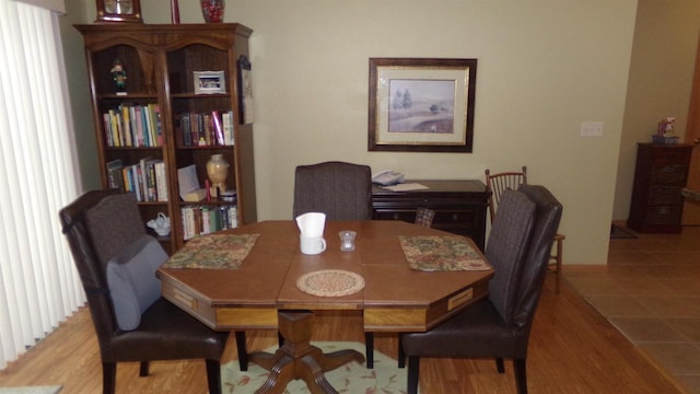 dining space with light hardwood / wood-style floors