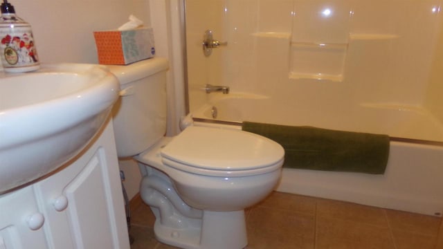 full bathroom featuring tile patterned floors, toilet, vanity, and bathing tub / shower combination