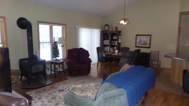 living room featuring a wood stove and hardwood / wood-style floors