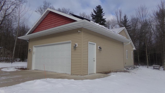 view of snow covered garage