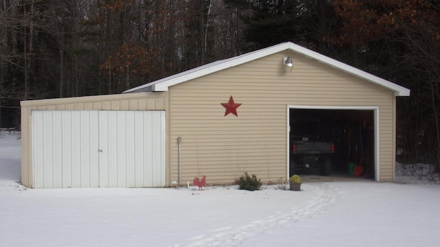 view of snow covered garage