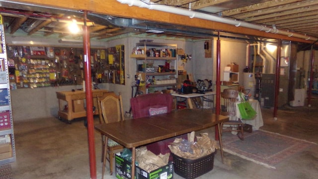 basement featuring heating unit and gas water heater