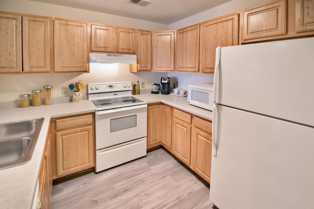 kitchen with white appliances, sink, light wood-type flooring, and light brown cabinets