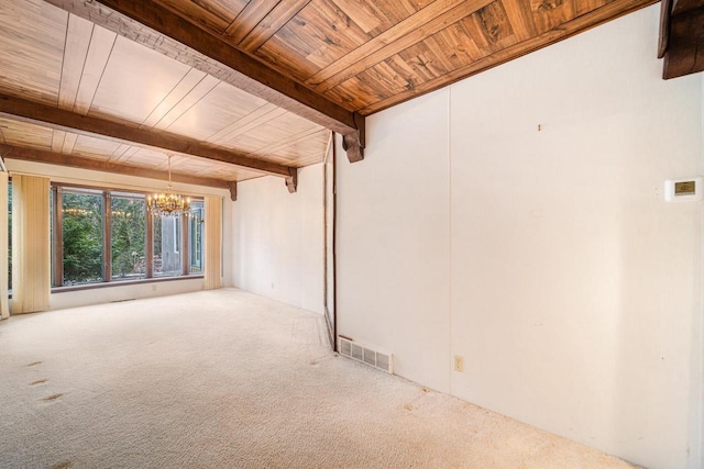 carpeted spare room featuring beam ceiling, a notable chandelier, and wood ceiling