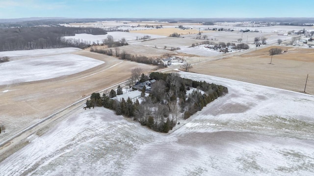 snowy aerial view featuring a rural view