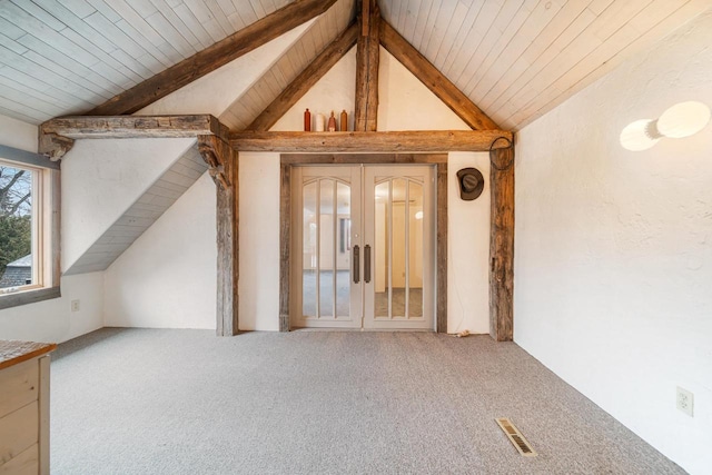 interior space featuring french doors, carpet flooring, wooden ceiling, and lofted ceiling with beams