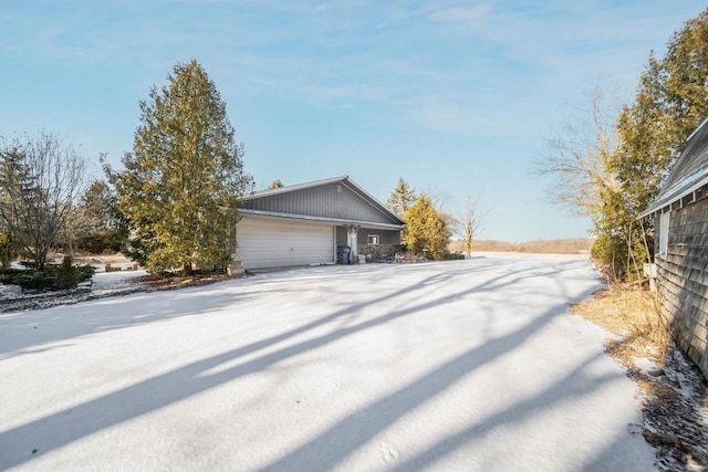 view of side of property with a garage